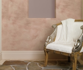Classic chair in front of white, pink and color designed wall